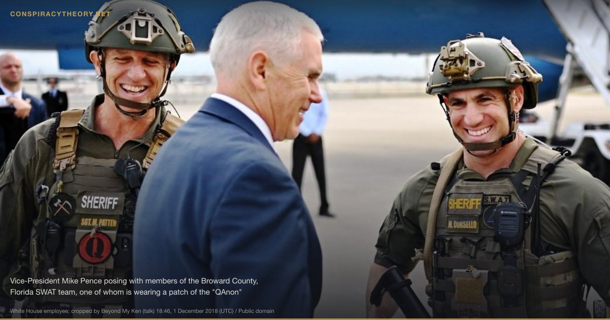 Adrenochrome Harvesting Conspiracy Theory (2018) — Vice-President Mike Pence posing with members of the Broward County, Florida SWAT team, one of whom is wearing a patch of the "QAnon" far-Right conspirationist movement.