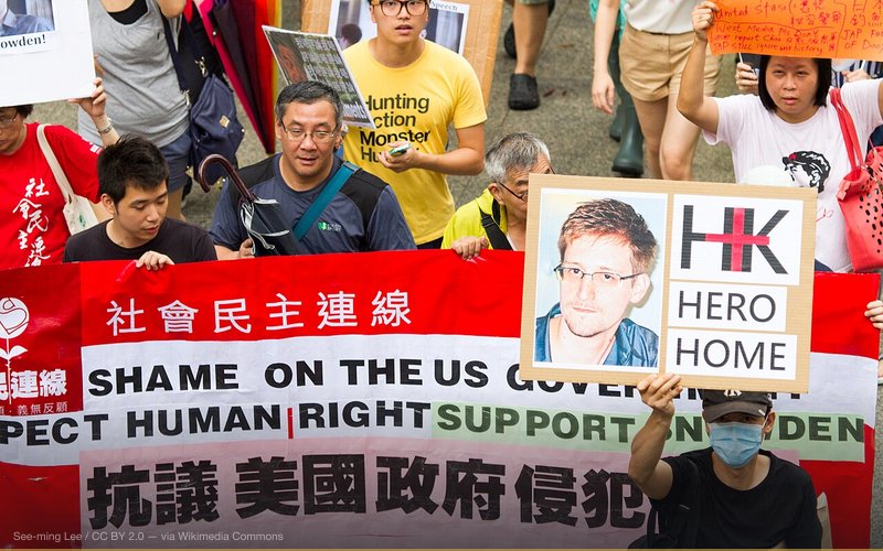 Whether Edward Snowden is a “hero” is up for debate, but what the NSA PRISM whistleblower did achieve is providing evidence of something many have suspected—that the US government is mining valuable data on the Internet. Big data analysis is nothing new—companies who provide free internet services have been doing this for years. Why did you think that Twitter has no advertising but manage to get so much venture capital investments? It is because it is very easy for them to analyse decode trending opinions on the web. Google’s company tagline has always been “Don’t be evil”—mostly because the same technology that can be used for good can be used for evil. Mint.com uses big data to track consumer spending and financial status. Biomedical researchers can use big data to track virus outbreaks. The United States government could certainly use big data to track terrorist activities — but the real question is if they whether or not they would utilise the data they mine for other purposes too. Also amongst Snowden's revelations, which have enraged many in Hong Kong, happens to be evidence of the US Government’s active hacking of local universities and businesses. Hacking for personal gain is definitely illegal. When the US blamed China for cyber attacks, they utilised their influence over the 'international' media to paint an ugly picture of China, but their accusation simply shows hypocrisy in the country’s own politics. And this fact has provided ample ammunition for political activists world wide. SML Data + Date: 2013-06-15T15:42:31+0800 + Dimensions: 5184 x 3456 + Exposure: 1/250 sec at f/5.0 + Focal Length: 190 mm + ISO: 800 + Camera: Canon EOS 7D + Lens: Canon EF 100-400mm f/4.5-5.6L IS USM + GPS: 22°16'43" N 114°9'39" E + Location: 香港中環花園道 Garden Road, Central, Hong Kong + Workflow: Lightroom 4 + Serial: SML.20130615.7D.42298 + Series: SnowdenHK: 香港聲援斯諾登遊行 Hong Kong Rally to Support Snowden, 新聞攝影 Photojournalism Media Licensing Creative Commons (CCBY) See-ming Lee 李思明 / SML Photography / SML Universe Limited Is Snowden a Hero? / SnowdenHK: 香港聲援斯諾登遊行 Hong Kong Rally to Support Snowden / SML.20130615.7D.42298 / #SnowdenHK #新聞攝影 #Photojournalism #CreativeCommons #CCBY #SMLPhotography #SMLUniverse #SMLPublicMedia #SMLOpinions / #中國 #中国 #China #香港 #HongKong #攝影 #摄影 #photography #Rally #Snowden #EdwardSnowden #events #people #Banner #street #Hero #US #Gov #opinions #bigdata — related to COINTELPRO Tactics Still Active Today?