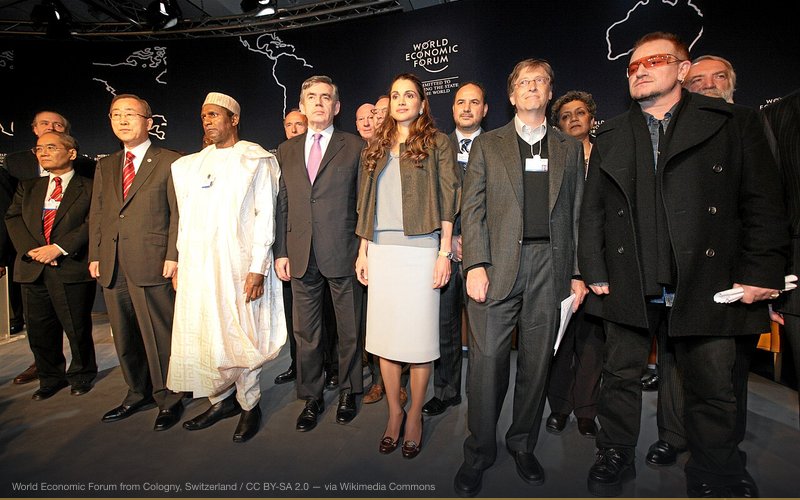 DAVOS/SWITZERLAND, 25JAN08 - Bono (R), William H. Gates III, Chairman, Microsoft Corporation, USA (2R), H.M. Queen Rania (3R) Al Abdullah of the Hashemite Kingdom of Jordan, Member of the Foundation Board of the World Economic Forum, Gordon Brown, Prime Minister of the United Kingdom (4R), Yar' Adua, President of Nigeria (5R), Secretary General of the United Nations Ban Ki- Moon (6R) and other participants stand together to 'Call to Action on the Millenium Development Goals' during the Annual Meeting 2008 of the World Economic Forum in Davos, Switzerland, January 25, 2008. — related to COVID Vaccine Microchip / Tracking