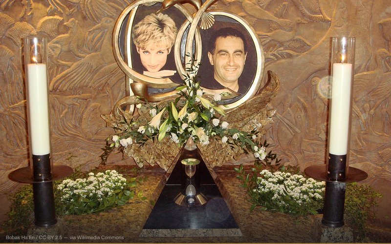 One of the two memorials to Diana, Princess of Wales, and Dodi Al-Fayed, located in the Harrods department store in London. The pyramid-shaped display holds a wine glass still smudged with lipstick from Diana's last dinner as well as an engagement ring Dodi purchased (presumed for Diana) the day before they died. — related to Princess Diana Faked Her Death