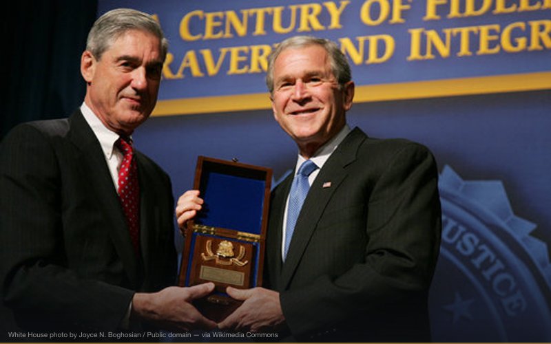 President George W. Bush is presented with an honorary FBI Special Agent credential by FBI Director Robert Mueller Thursday, Oct. 30, 2008, at the graduation ceremony for FBI special agents in Quantico, Va. White House photo by Joyce N. Boghosian — related to FBI Entrapment Operations