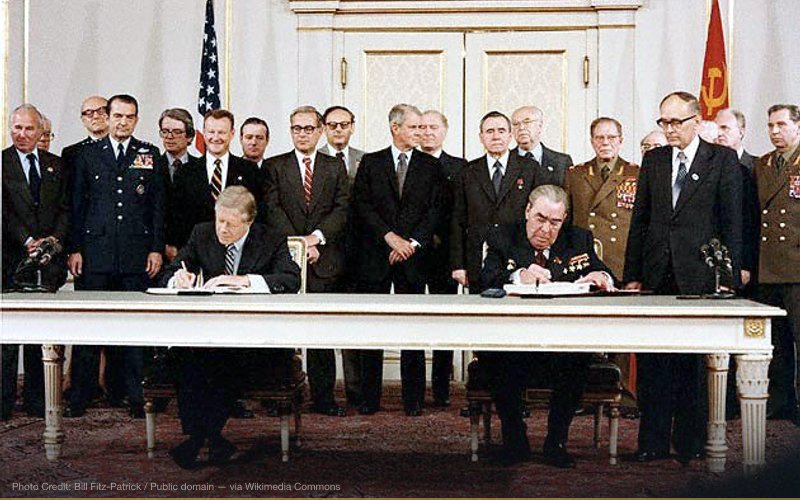 President Jimmy Carter and Soviet General Secretary Leonid Brezhnev sign the Strategic Arms Limitation Talks (SALT II) treaty, June 18, 1979, in Vienna. — related to Operation Cyclone — CIA Arms to Afghan Mujahideen / Al-Qaeda Blowback