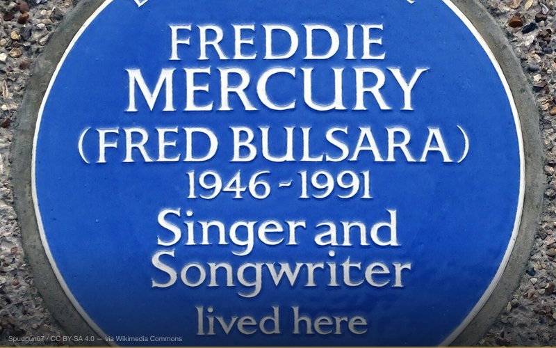 Blue plaque erected on 1st September 2016 by English Heritage at 22 Gladstone Avenue, Feltham, London TW14 9LL, London Borough of Hounslow — related to We Are the Champions — The Missing 'Of the World'